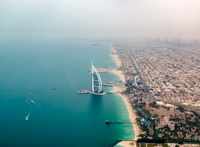 an aerial view of the burj al arab in the middle of the ocean